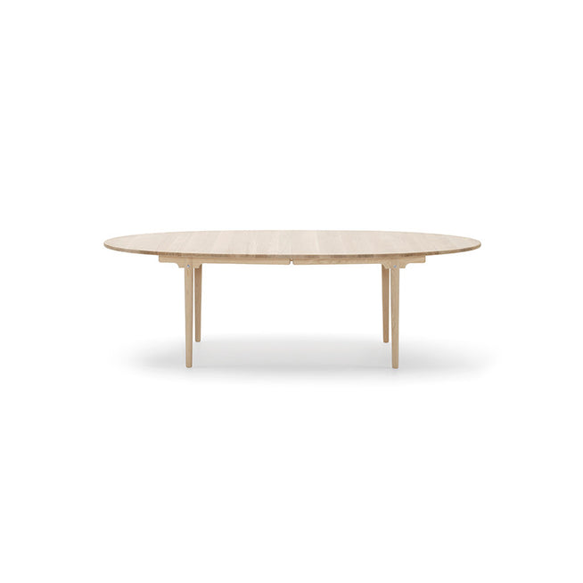 Photo of Ch339 dining table from Carl Hansen & Søn (oak, oil, pull-out for 2 leaves incl. 1 wooden support leg in black)