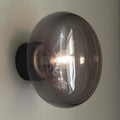 Thumbnail photo of Karl-Johan Wall Lamp Black Stain Oak/Smoke Glass