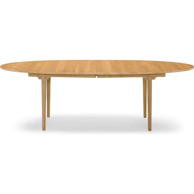 Photo of Ch339 dining table from Carl Hansen & Søn (oak, oil, pull-out for 2 leaves incl. 1 wooden support leg in black)
